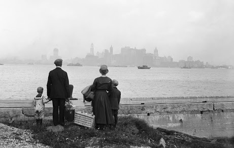 immigrants looking at the NY skyline JR